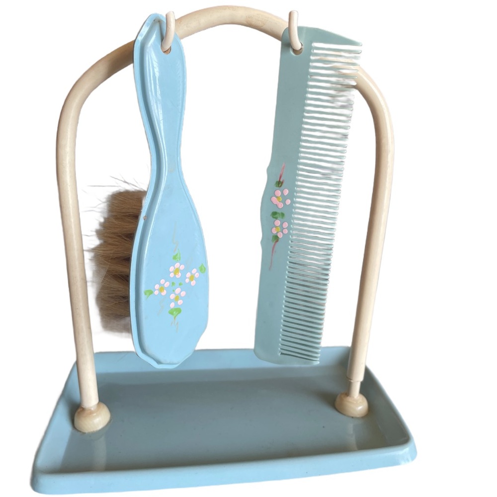 Vintage baby brush and comb set with stand.